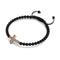 Croix de cristal | Or rose 18 carats et bronze à canon | Noir | Bracelet Charmballa en macramé
